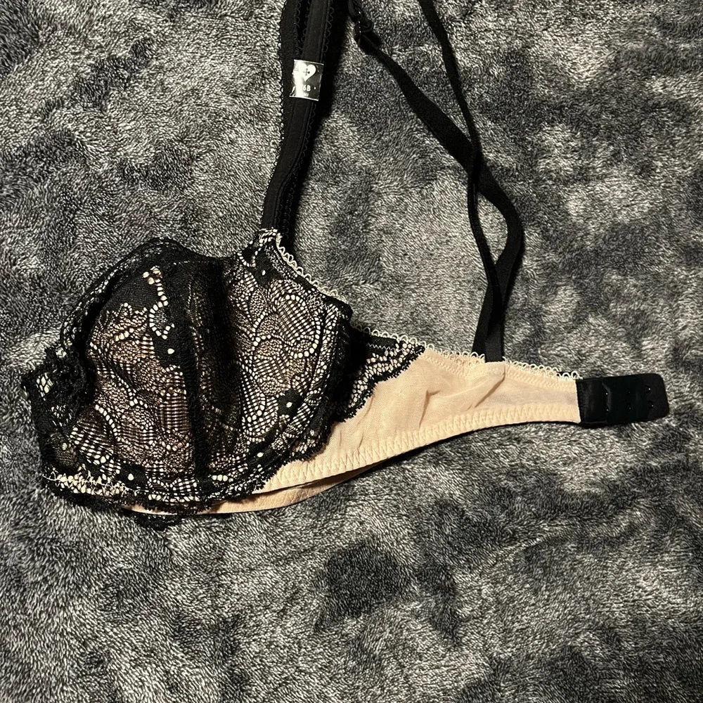 BLACKHEART bra new with partial tags.  Black and nude color. Underwire. 36B